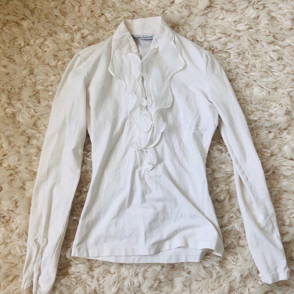 White blouse with frilly collar